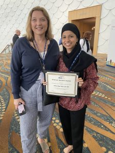 Dr. Julie Bynum and Dr. Halima Amjad posing with award certificate