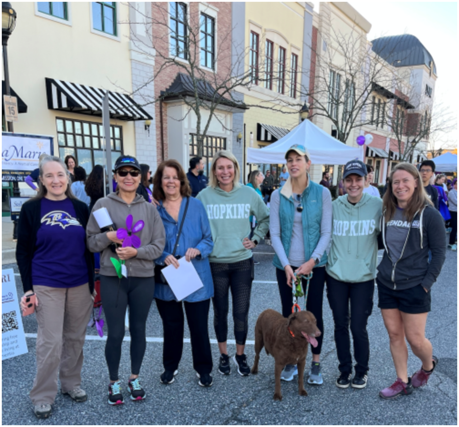 Seven female participants from Johns Hopkins University. One participant has a brown dog on lease.